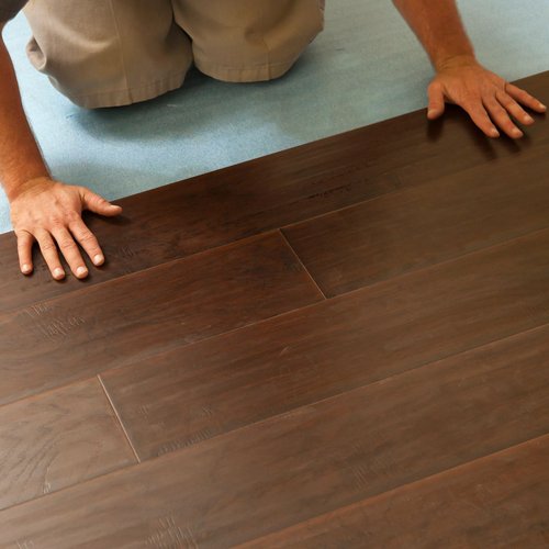 person installing flooring - Cut-Rite Carpets & Design Center in NY
