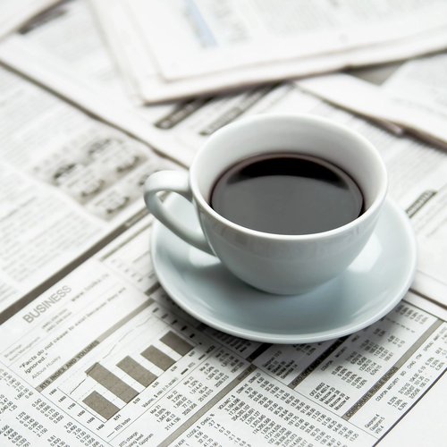 coffee mug on newspaper - Cut-Rite Carpets & Design Center in NY